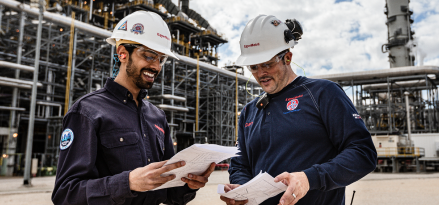 ExxonMobil refinery worker talking on the phone