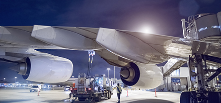 Ground crew refuelling A380 aircraft at airport 