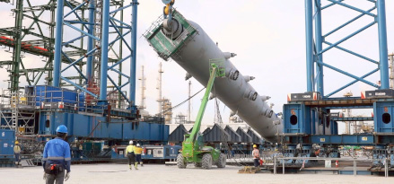 The construction crew readies a large high-pressure reactor in Singapore.