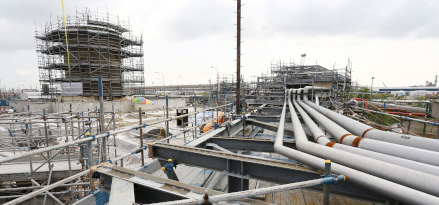 Construction crews working In the Singapore ExxonMobil refinery location.