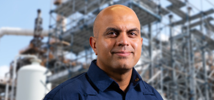 Khalid Ashraf, Venture Executive and Project Director for ExxonMobil Asia Pacific, stands in front of on-site construction