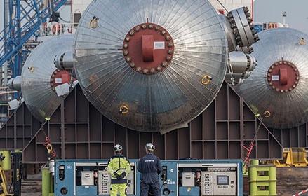 Rotterdam Refinery Expansion construction with construction workers