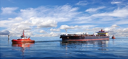 Tanker ship guided by tug boats Tanker ship guided by tug boats